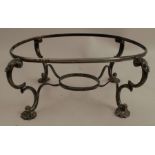 A Victorian silver dish warming stand, of oval form, raised on double c scroll legs with pad feet,