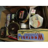 A box of assorted biscuit tins