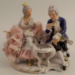A Dresden porcelain figure group, of a seated coupe at a games table