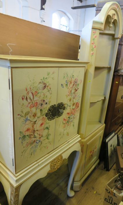 A painted floor standing corner cupboard, decorated with flowers, together with a drinks cabinet,