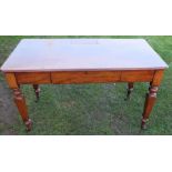 A 19th century mahogany rectangular writing table, having a small lift-up stationery compartment,