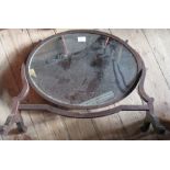 An oval mahogany framed dressing table mirror