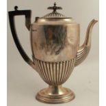 A silver coffee pot, with gadrooned lower body and raised on an oval pedestal foot, Sheffield