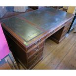 A reproduction mahogany pedestal desk, fitted with nine drawers around the kneehole, 34ins x