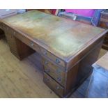 A reproduction mahogany partners desk, fitted with one long frieze drawer flanked by two further