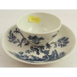 A first period Worcester tea bowl and saucer, decorated in the Birds in Branches pattern, crescent