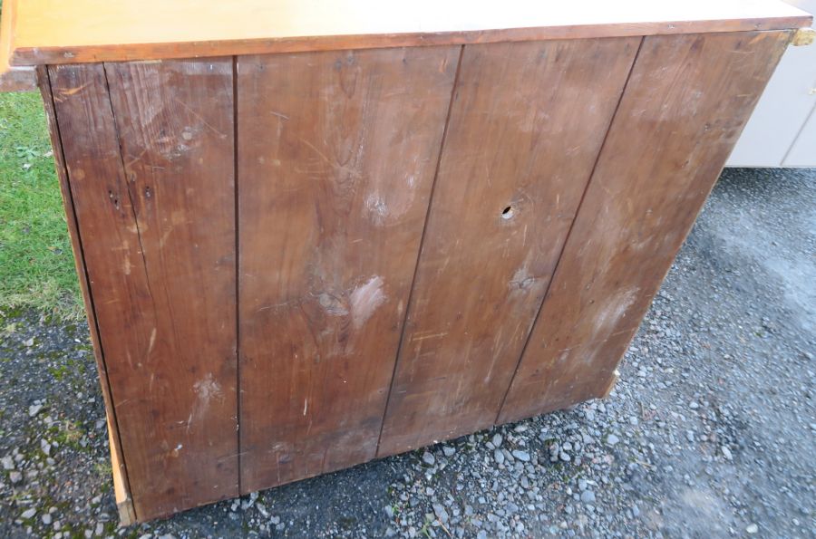 A 19th century pine chiffonier, fitted with one longer frieze drawer, over two panel doors, width - Image 2 of 3