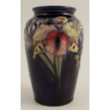 A Moorcroft pottery vase, decorated in the Iris pattern, height 5ins