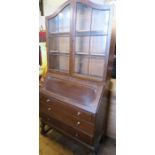 An oak bureau bookcase, height 76ins, width 36ins