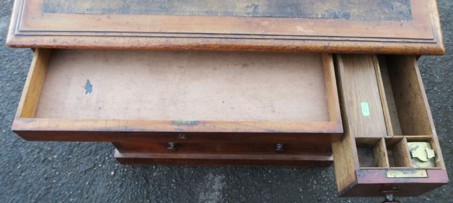 A 19th century mahogany desk, with sloping writing surface, over six drawers, raised on a plinth - Image 2 of 4