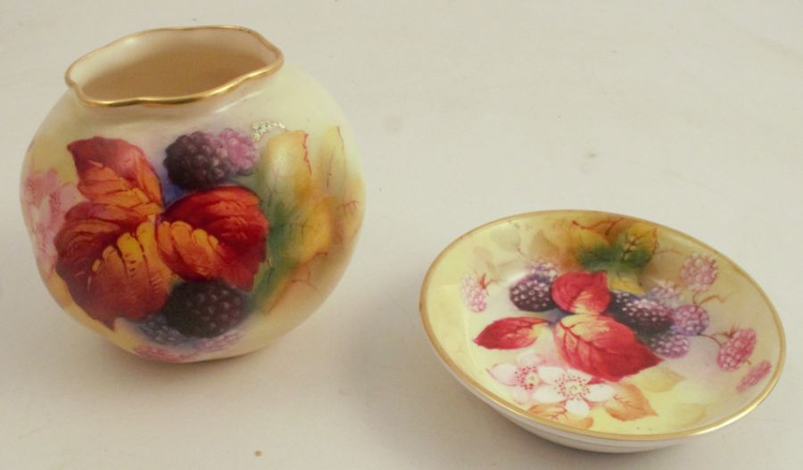 A Royal Worcester vase, decorated with autumnal fruit and leaves by K Blake, shape number G161,