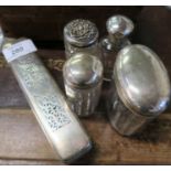 A collection of dressing table bottles, with silver tops