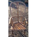 An Antique elm Windsor armchair, with pierced splat and H stretcher