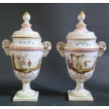 A Pair of Veuve Perrin Faience Rams Vases with ram's mask handles and covers, decorated with