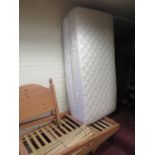 A Pine Bed Frame with Guest Bed Under and with two mattresses (one still sealed)