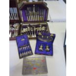 An Oak Part Canteen of Silver Plated Cutlery, plated cigarette box, Indian cruet in plush case and