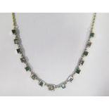 A 15ct Gold, Emerald and Diamond Necklace, 55cm, 6.0g (length of stone set area c. 10cm, diamonds c.