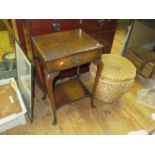 A Walnut Side Table with a single frieze drawer, two glass wine funnels, basket and cat ornament