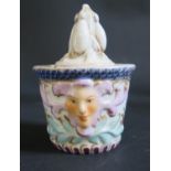 A 19th Century German Porcelain Inkwell with twin moulded masks, blue underglaze crossed sword mark,
