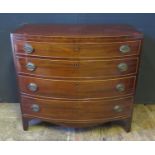 An Early 19th Century Mahogany and Satinwood Strung Bow Fronted Chest of Four Long Drawers, 91cm