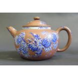 A Chinese Yixing Terracotta Teapot decorated in blue enamels, 10.5cm high