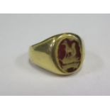 A High Carat Gold Seal Ring decorated with a canine and 'LIBERIE' in a red hardstone, size N.5, 10.