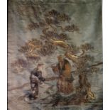 A 19th Century Chinese Gold Thread on Silk Embroidery decorated with two figures in a landscape,