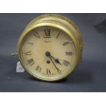 A SMITH 8 Day Brass Cased Ship's Clock, 7" dial. Needs attention