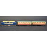 An Electric Brimtoy Tinplate D5001 Diesel Locomotive and Carriages. Carriages are sun faded on one