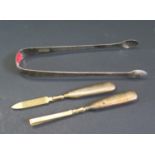 A Pair of Georgian Silver Sugar Tons and two silver handled manicure tools, 36g