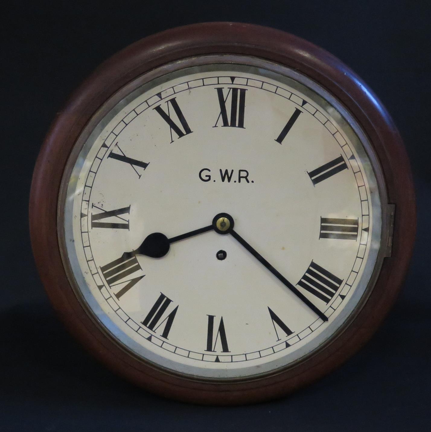 A Rare Twin Dial Railway Station Clock with dial marked G.W.R. a single chain driven fusee movement