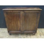 A Regency Mahogany Press Cupboard fitted with three slides and two drawers over, 111(w)x53(d)x101(