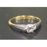 An 18ct Gold and Platinum Diamond Set Solitaire Ring, size M.5, 2.3g (EDW .2ct)