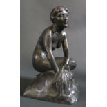 An Antique Bronze Sculpture of a nude female kneeling, unsigned, 17cm