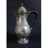 An Edward VII Silver Coffee Pot with repoussé foliate a scroll decoration, Chester 1906, George