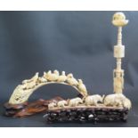 An Antique Japanese Carved Ivory Tusk decorated with birds (base 27cm), one other with elephants and