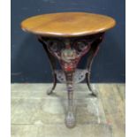A Victorian Cast Iron Bistro Table, the base cast with figures of Brittania bearing a shield with