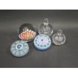 A Perthshire Glass Paperweight, two others and graduated pair of glass scent bottles