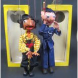 A Pelham Puppet SM Policeman and SM Pirate in damaged boxes