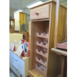 A Modern Waxed Pine Bottle Rack with drawer over