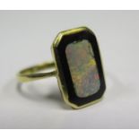 An 18ct Gold, Opal and Black Onyx Ring, size N.5, 2.8g