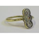 A Three Stone Diamond Ring in a precious yellow metal setting (mark indistinct), size N, 2.1g