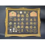 A Mounted Collection of British Army Cap Badges and two Coldstream Guards named plaques, 58x48cm