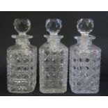 A Set of Three Cut Glass Decanters, 21.5cm tall