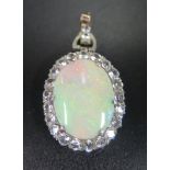 A Large White Opal Pendant with white stone surround, c. 46mm drop