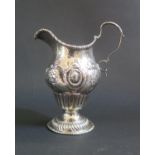 A George II Silver Cream Jug with repousse scrolling decoration, London 1755?, W.A, 12.5cm high, 97g