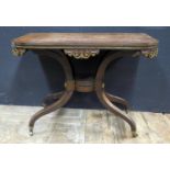 A Regency Rosewood and Brass Inlaid Fold Over Card Table raised on four scrolling legs, 94cm.