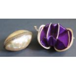A 19th Century Mother of Pearl Hinged Shell Purse with purple silk lined interior (6cm) and one