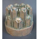 A 19th Century Castellated Copper Jelly Mould stamped St. John's Coll., 14.5cm diam.