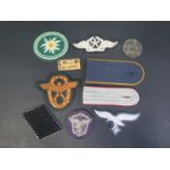 A Collection of German Military Cloth Badges including Edelweiss, Flying Technical Trade, paper